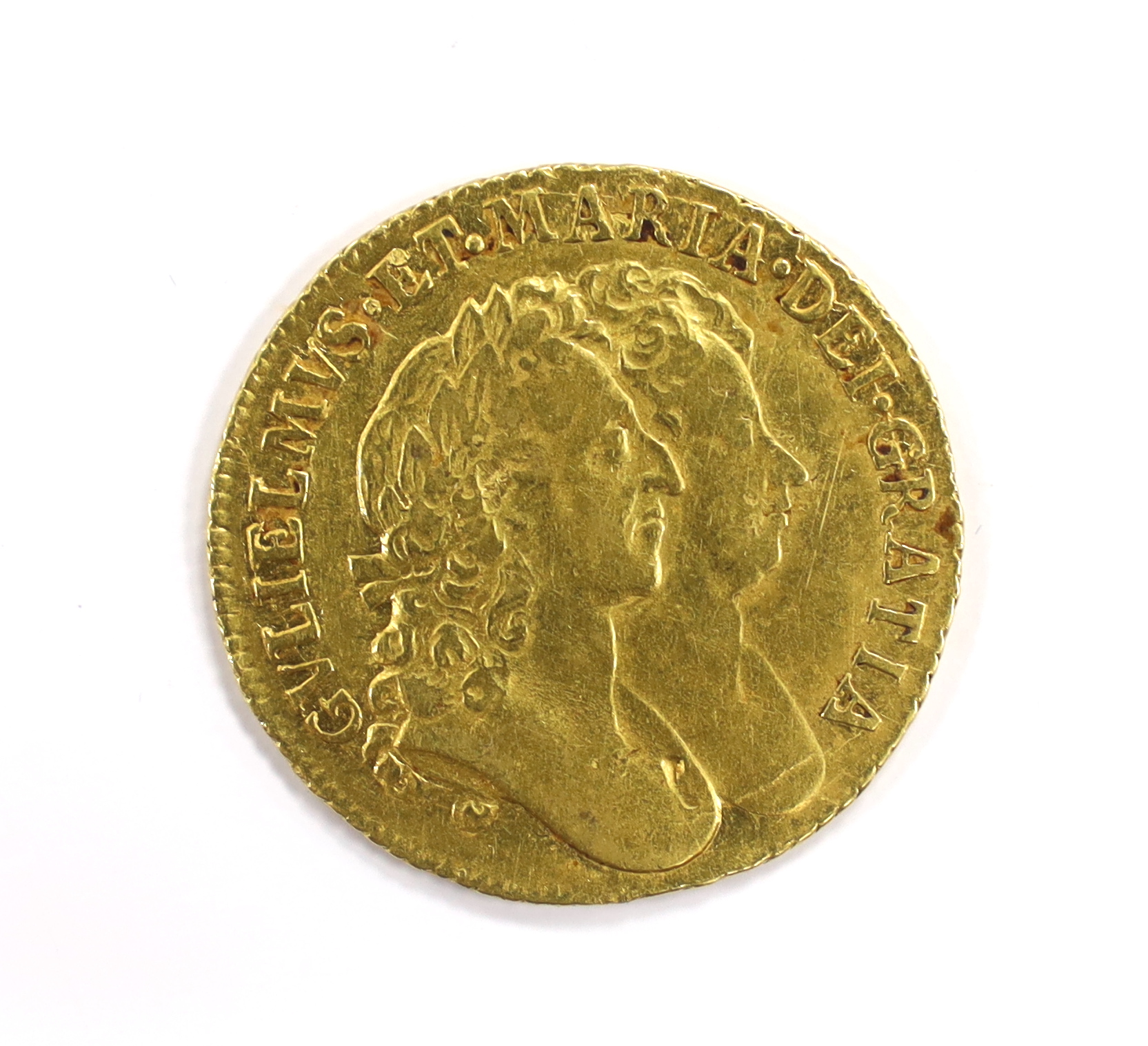 British gold coins - A William and Mary gold guinea, 1689, probably demounted at 12 o’clock, otherwise good Fine (S3426), Provenance bought from Richard Lobel and co Ltd, London, 7th March 1977 for £275